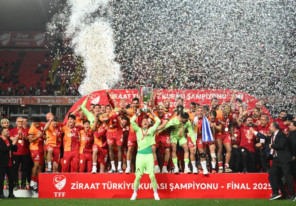 Galatasaray players celebrate winning the title...