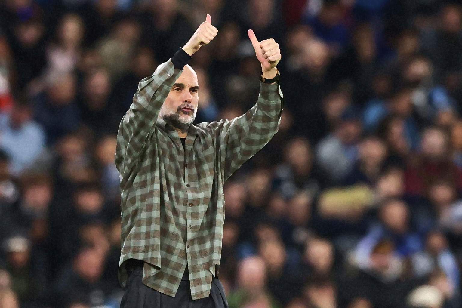 Pep Guardiola gives a thumbs up vs Real Madrid.